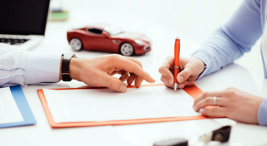 Two people are cutting paper with scissors and a red pencil.